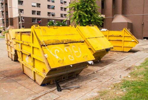 Team members from Sam Trash Solutions clearing a household